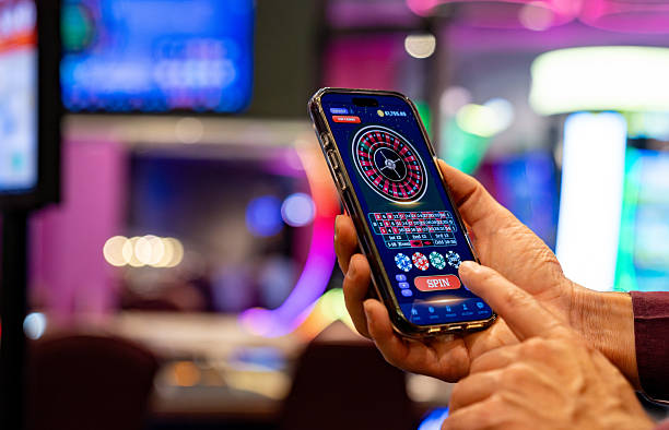 Antarmuka aplikasi mobile vinstore menampilkan meja live-dealer blackjack dengan dealer dan pemain